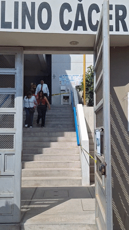 Building entrance with exit signage observed in Mariano Melgar