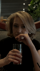 Woman documents dining experience at busy Ufa restaurant