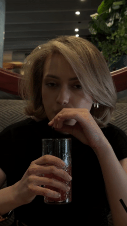 Woman documents dining experience at busy Ufa restaurant