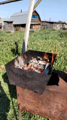 Rural Russian scenes: burning fire pit and decorative ceramic plate