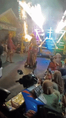 Traditional night procession with giant effigy in Malang streets