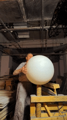 Large white sphere gets a dusting in a Karaganda workshop