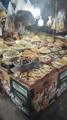 South Jakarta market in full swing — produce, dried goods, and heavy machinery