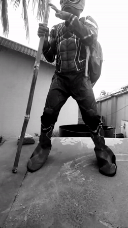 Child in Spider-Man costume plays across Nigerian neighborhoods