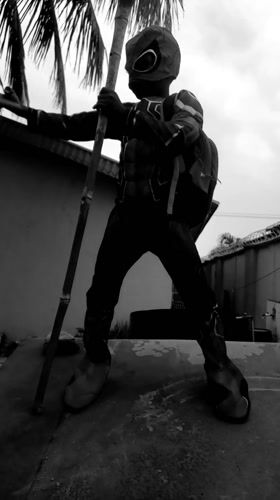 Child in Spider-Man costume plays across Nigerian neighborhoods