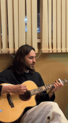 Acoustic guitar performance captured in Chaikovsky, Russia residence