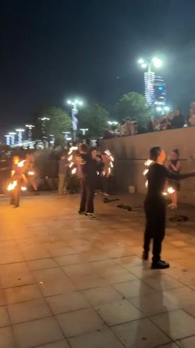Fire poi performers light up a Yekaterinburg waterfront night