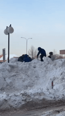 Family enjoys winter day sledding and playing in snowy Odintsovo