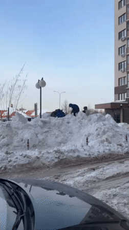 Family enjoys winter day sledding and playing in snowy Odintsovo