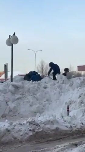 Family enjoys winter day sledding and playing in snowy Odintsovo