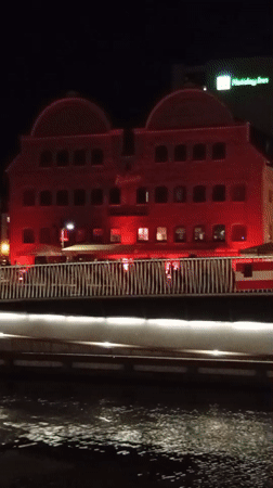 Gdańsk waterfront and old town lit up at night