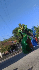 Elaborate costume parade rolls through Plaosan streets