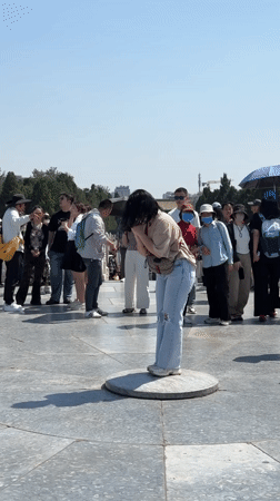 Early morning visitors gather at Temple of Heaven platform