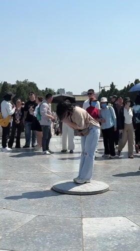 Early morning visitors gather at Temple of Heaven platform
