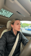Woman photographed taking selfies in Audi driver's seat, Tbilisi