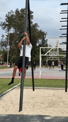 Man exercises on climbing poles in Puebla park
