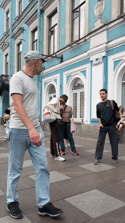 Summer afternoon street life and café moments in Saint Petersburg