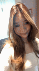 Woman takes mirror selfies in Jiayuguan bathroom