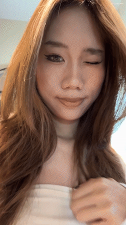 Woman takes mirror selfies in Jiayuguan bathroom