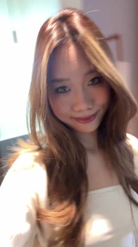Woman takes mirror selfies in Jiayuguan bathroom