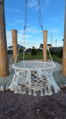 Kid, macrame swing, and two big dogs at a Russian dacha