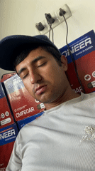 Man takes selfies in tire shop in Bukhara