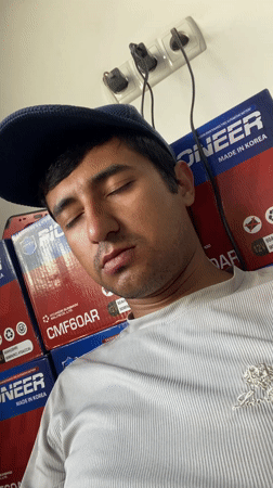 Man takes selfies in tire shop in Bukhara