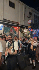 Live band playing an outdoor night gig in Tel Aviv