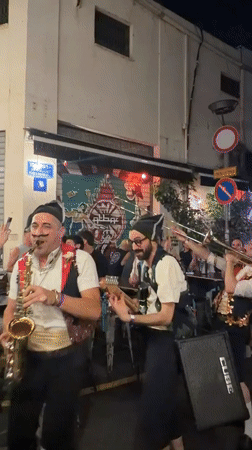 Live band playing an outdoor night gig in Tel Aviv