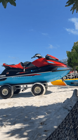 Seaplane, jet ski, and open water near Malé