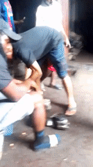 Auto repair work and gas station activity in Onitsha