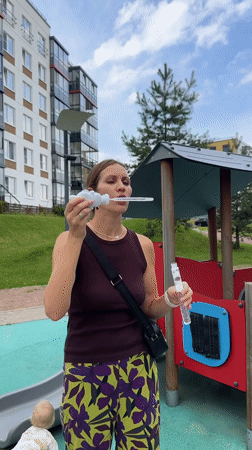 Bubble-blowing at a Vsevolozhsk playground on a summer afternoon