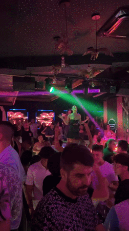Neon skeletons and a live performer light up a Sozopol nightclub