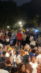 Nighttime street performance draws crowd in Miraflores, Peru