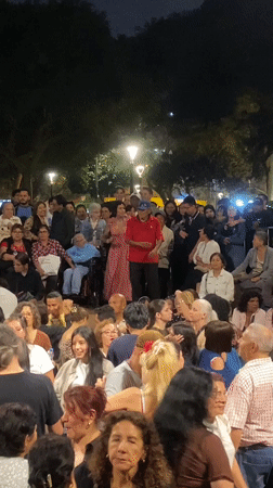Nighttime street performance draws crowd in Miraflores, Peru