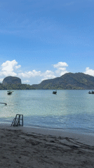 Longtail boats filmed at Thai beach scene in Ban Ko Klang