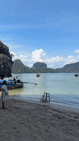 Longtail boats filmed at Thai beach scene in Ban Ko Klang