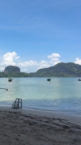 Longtail boats filmed at Thai beach scene in Ban Ko Klang