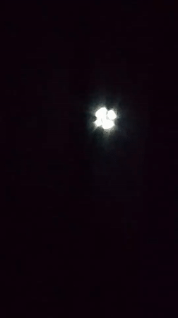 Moon tracked through a dark sky, halo and all