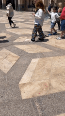 Crowds gather in tiled courtyard in Casablanca
