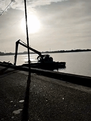 Construction equipment spotted on waterfront in Lhokseumawe, Indonesia