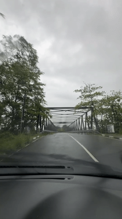 Rainy day bridge crossing captured in Kiriberiya, Sri Lanka