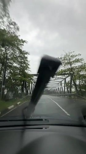 Rainy day bridge crossing captured in Kiriberiya, Sri Lanka