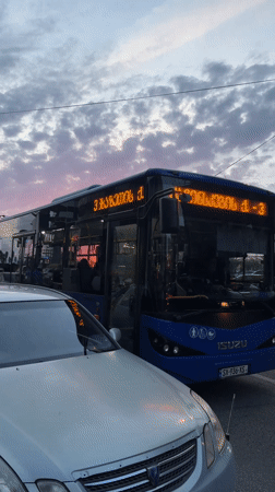 Woman prepares jump rope exercise in urban Batumi