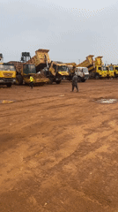 Morning construction activity and tricycle taxi operations observed in Abuja