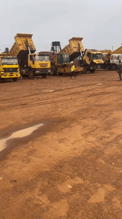 Morning construction activity and tricycle taxi operations observed in Abuja