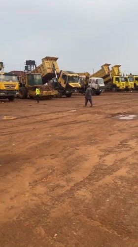 Morning construction activity and tricycle taxi operations observed in Abuja