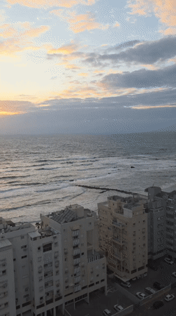 Sunset observed over Mediterranean coast in Bat Yam