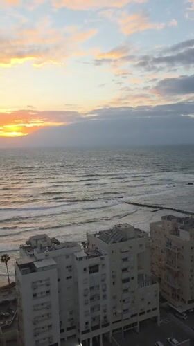 Sunset observed over Mediterranean coast in Bat Yam