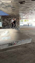Skateboarder lands kickflip trick in Barcelona urban setting